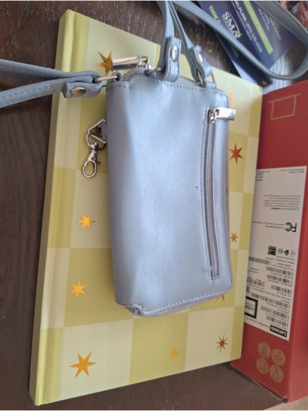 Loght blue wallet with many pockets